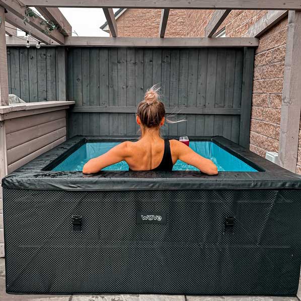 woman relaxing in a Wave Garda hot tub