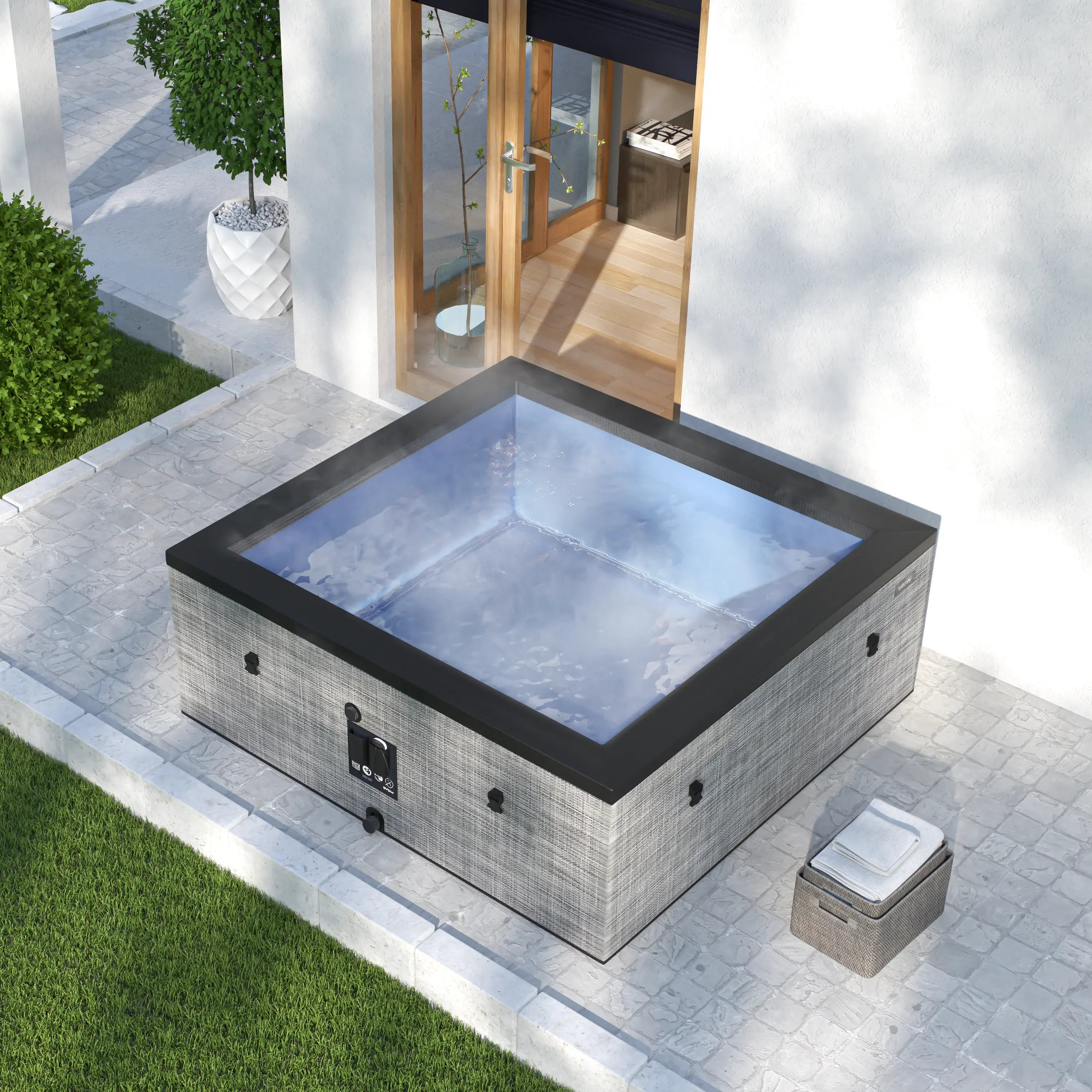 Garda 6 person Graphite Grey hot tub on a patio