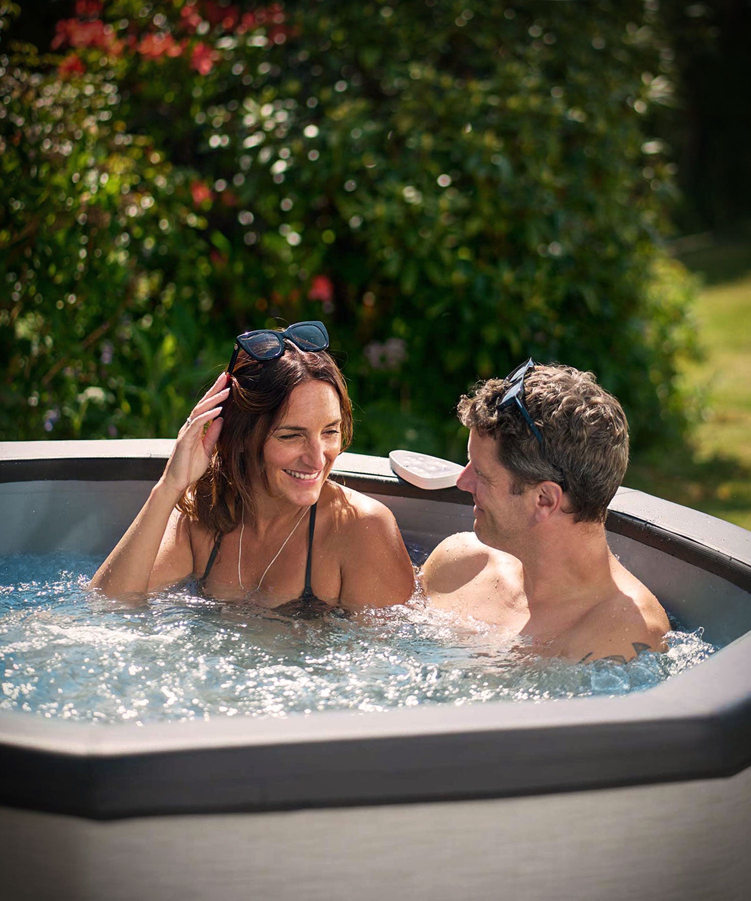 Couple relaxing in a Wave hot tub